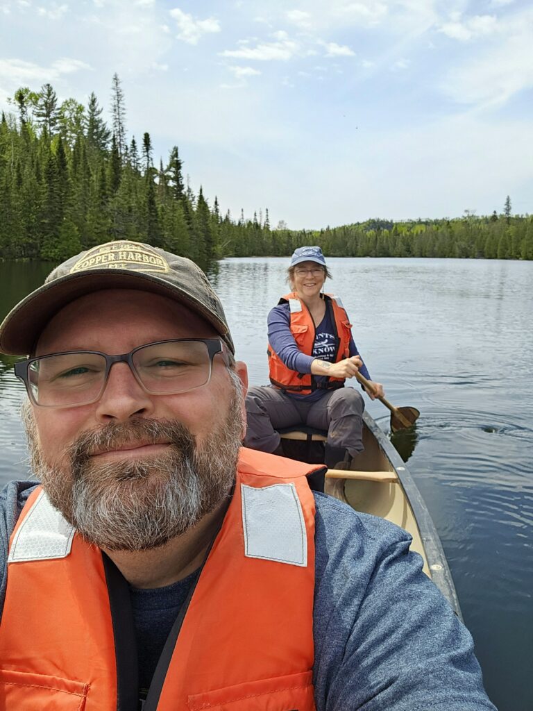 Image of Ryan and Linda, owners of Superior By Nature, in a canoe